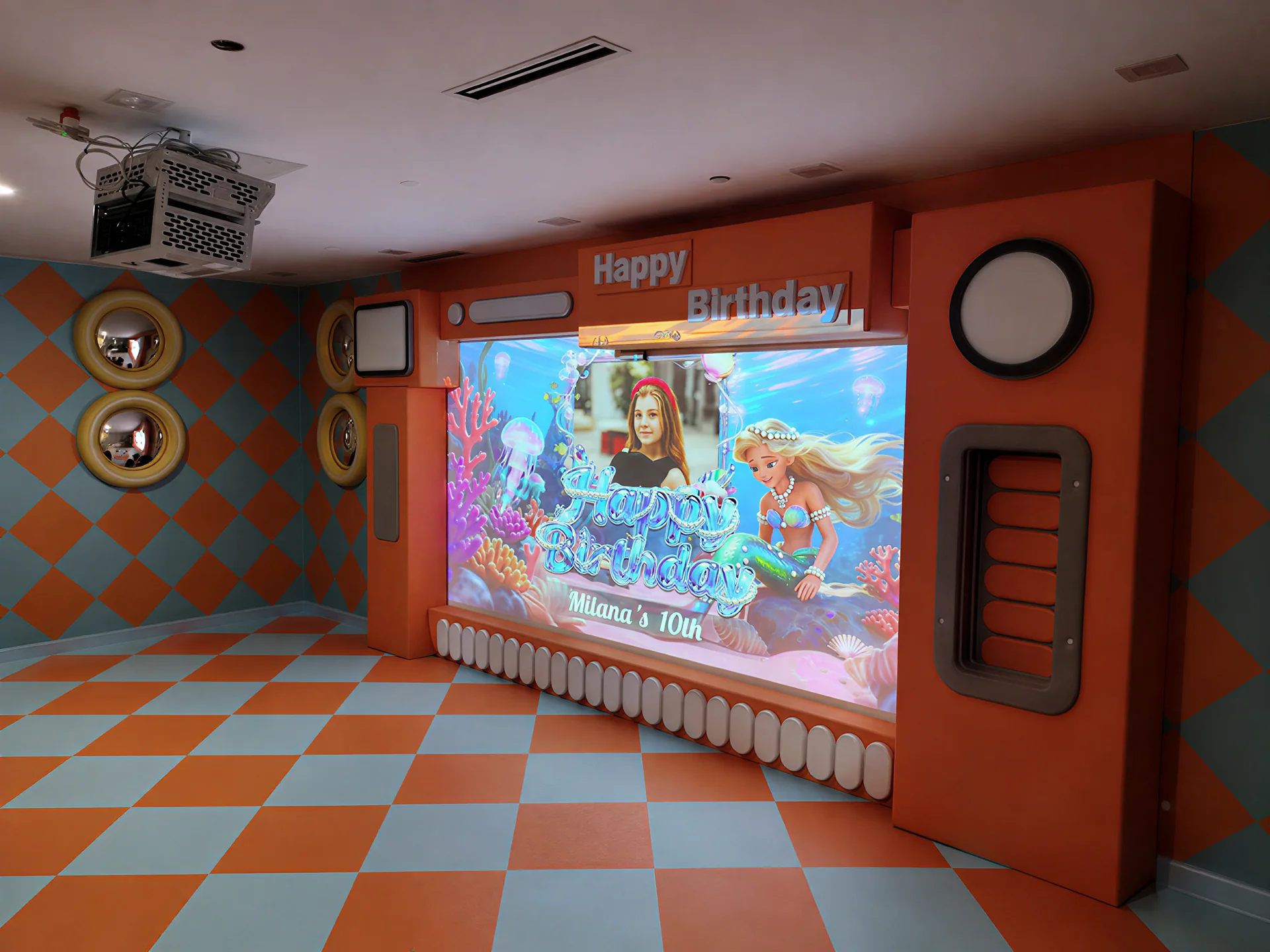 PartyDrax personalized birthday projection in an adventure park party room