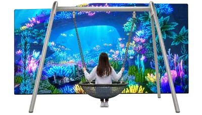Child on a Magic Swing in front of an underwater themed game screen