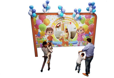 Two children celebrating in a PartyDrax room with a personalized birthday display